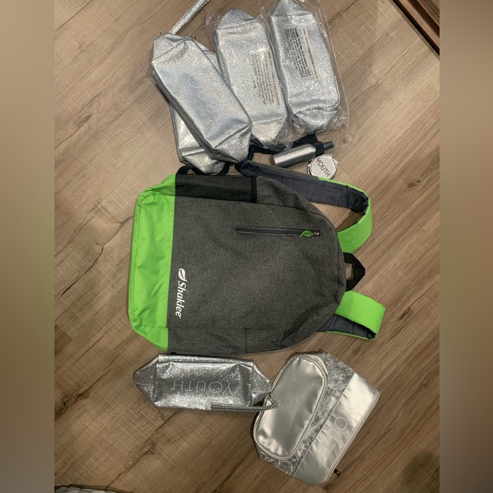 Limited addition Shaklee silver Youth cosmetic bag and backpack